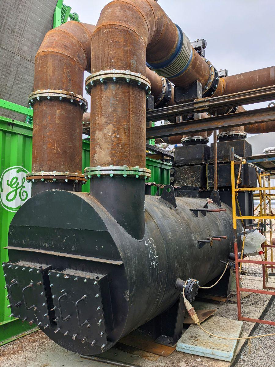 Assembly of boiler flue gas ducts connecting to a CHP unit